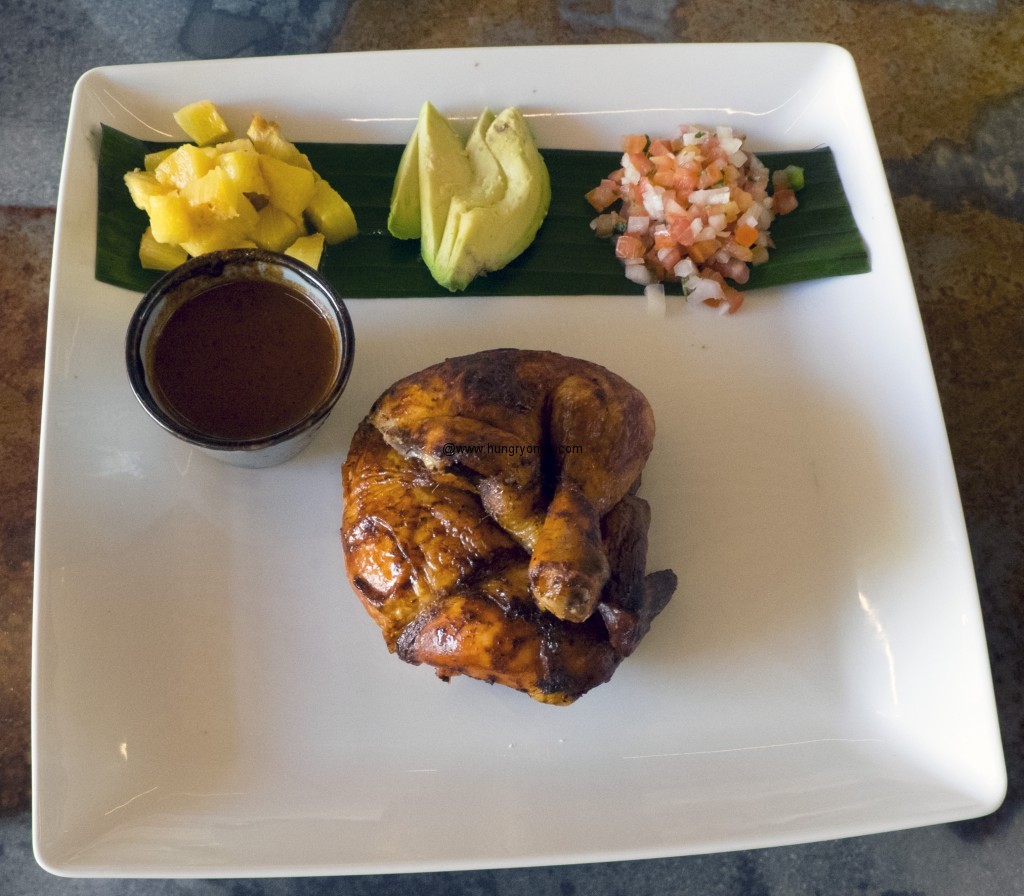 Chicken Annatto with pineapple, avocado, and achoite marinade